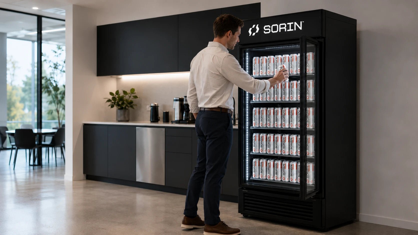 Employee grabbing a SORIN can from the office fridge