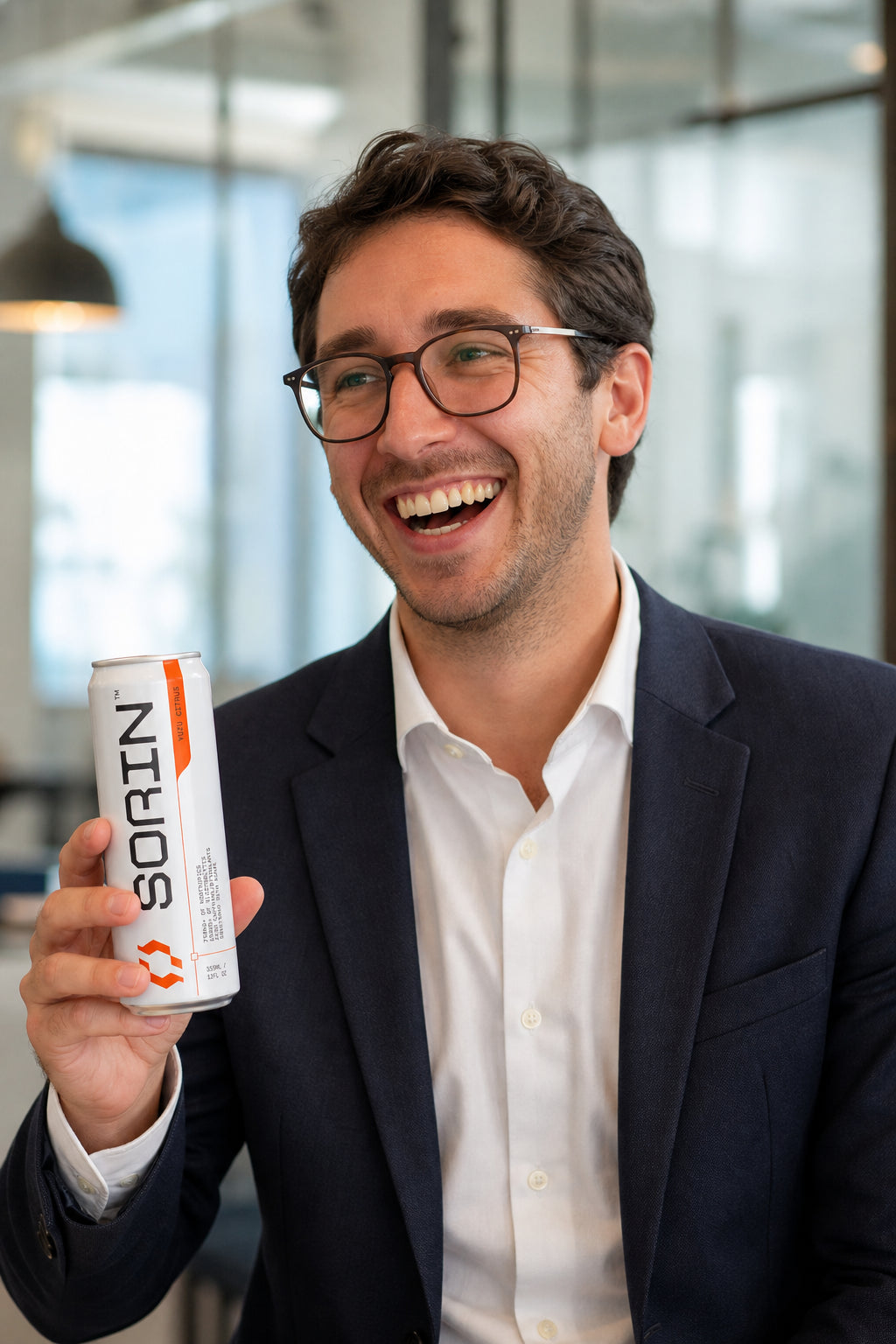 Happy employee holding a SORIN can